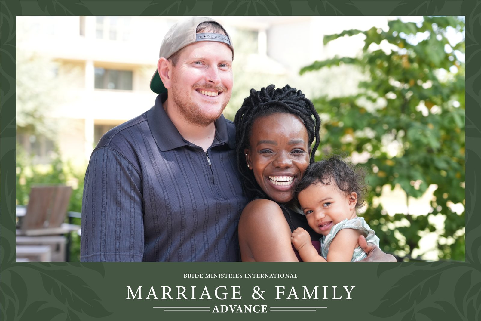 A couple holding their baby and laughing in their Marriage and Family Advance portrait